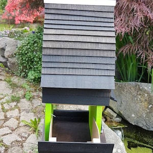 Enchanting bird feeder with integrated granny flat (nesting box)