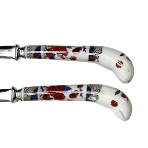 May include: A set of three ceramic nesting bowls in shades of blue, green, and white. The bowls feature a speckled glaze and a simple, modern design. The largest bowl measures approximately 6 inches in diameter.