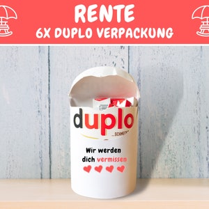 May include: A white cylindrical container with a red and white "Duplo" logo and the text "Wir werden dich vermissen" (We will miss you) with four red hearts. The container is filled with red and white chocolate bars.