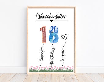 May include: A white framed print with the text "Wunscherfüller" and the number 18 made of money bills. The number 18 is attached to strings with the words "Happy Birthday to you" written below.
