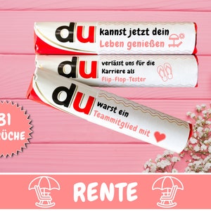 May include: Three candy bars with German text and red and white packaging are stacked on a pink wooden surface. The bars have phrases like "Enjoy Life Now" and "Leaving for a Career as a Flip-Flop Tester."