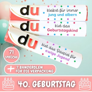 May include: Three pink and white wrapped candy bars with colorful polka dots and the text "du" in black and red. The text on the candy bars reads "bleibst für immer jung und albern", "bist das Geburtstagskind", and "bist das Beispiel für ewige Jugend". The bottom of the image shows a pink and white cake with candles and the text "40. GEBURTSTAG".