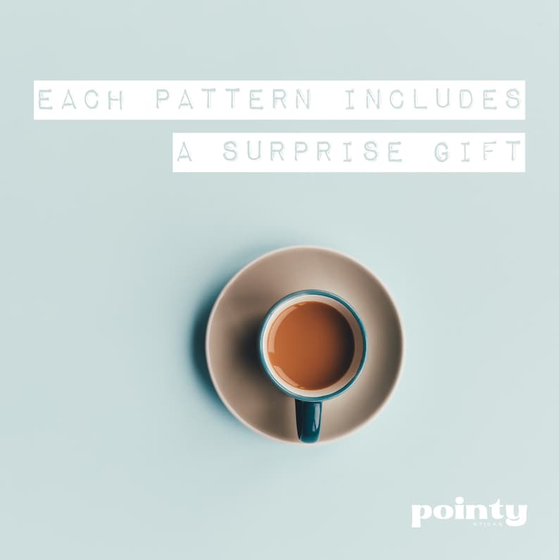 May include: A blue and white coffee cup with brown coffee inside, sitting on a beige saucer. The text "EACH PATTERN INCLUDES A SURPRISE GIFT" is above the cup.