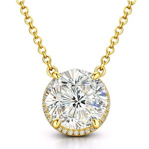 May include: A gold necklace featuring a large, round, clear gemstone pendant. The pendant is surrounded by smaller, clear gemstones and set in a gold bezel. The chain is also gold and has a delicate link design.