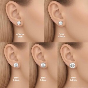 May include: A set of five round, clear stud earrings in silver-toned settings, displayed on ears to show size variations from 0.50ctw at 4mm, 1ctw at 5.2mm, 2ctw at 6.5mm, 3ctw at 7.4mm, to 4ctw at 8.2mm, providing a clear visual scale comparison.