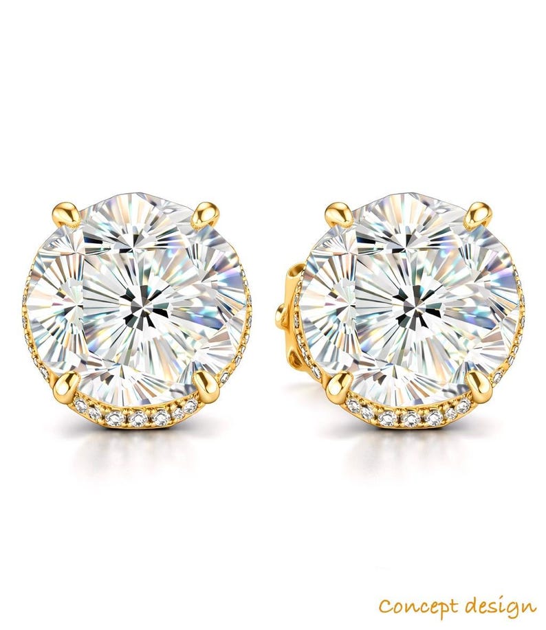 May include: A pair of gold stud earrings with large, round, clear gemstones. The earrings have a halo of small, clear stones around the main gem and are set in a gold setting. The text "concept design" is in the bottom right corner.
