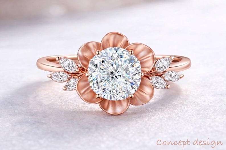 May include: Rose gold ring featuring a large, round, clear gemstone at the center, surrounded by a flower-shaped setting. Small, clear gemstones accent the petals. The ring band is also rose gold. The words "Concept design" are in the bottom right corner.