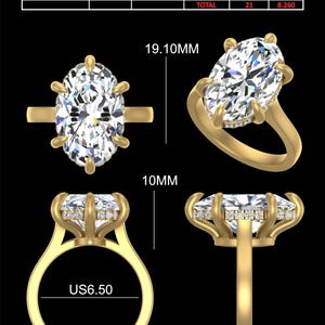 May include: A gold ring with a large oval-shaped diamond set in a prong setting. The ring is surrounded by smaller diamonds. The ring is 19.10 mm wide and 10 mm tall. The ring is also 1.80 mm thick and 2.50 mm wide at the band. The ring is size US 6.50.