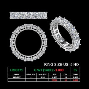 May include: A silver ring with a row of 16 square-shaped diamonds. The ring is size US 5 and the total diamond weight is 3.00 carats. The ring is made of 14 karat gold.