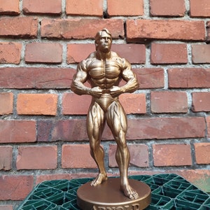 Arnold Schwarzenegger - ,,Most muscular&#39;&#39; statue with stand - 20/25/35/55cm height (Dark gold photoshoot)