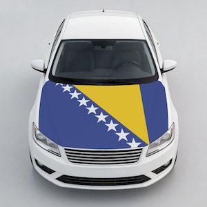 May include: A white saloon car featuring a custom bonnet wrap displaying the flag of Bosnia and Herzegovina. The design includes a blue background with a yellow triangle and a diagonal row of seven white stars and two half-stars along the edge.