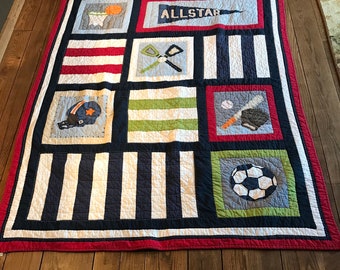Sports quilt and pillow sham.   Twin size.  Hand stitched.  Matching pillow sham.