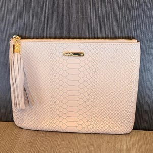 Gigi python clutch purse.