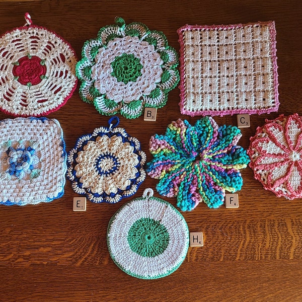 A variety of hand crocheted hot pads.