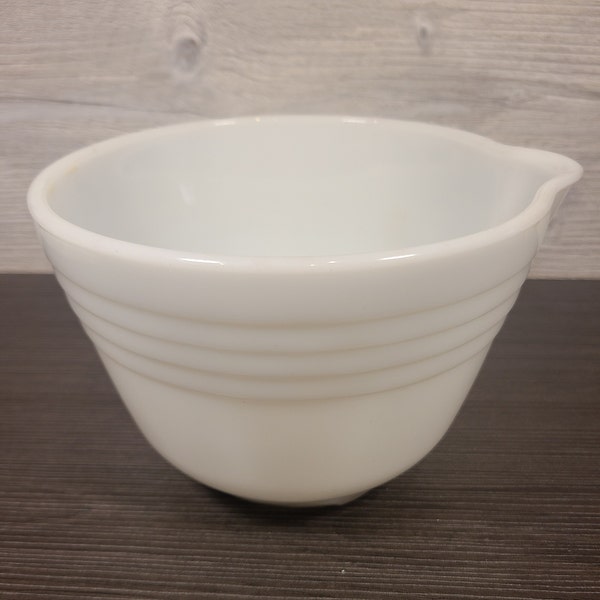 Vintage white glass mixing bowl with pour spout.