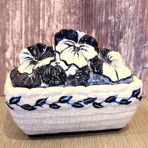 May include: A rustic wooden sign with the text "Welcome to our home" in white lettering. The sign features a distressed finish and a simple, inviting design, perfect for front door decor.