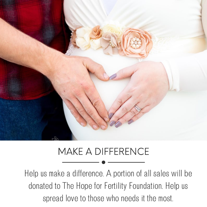 May include: A couple's hands form a heart shape over a pregnant belly. The woman is wearing a white dress with a floral sash. The man is wearing a red and black plaid shirt. The text "MAKE A DIFFERENCE" is at the bottom of the image.