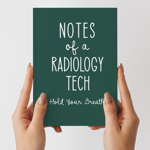 May include: A dark green notebook with the text "NOTES of a RADIOLOGY TECH" in white, with "Hold Your Breath" below. The notebook is held by two hands against a white background.
