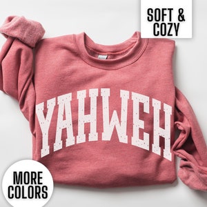 This Gildan Yahweh Crewneck sweatshirt is the perfect Christian gift for a religious woman. It says Yahweh in an athletic vintage font. This minimalist Jesus sweatshirt is perfect for a woman of faith.