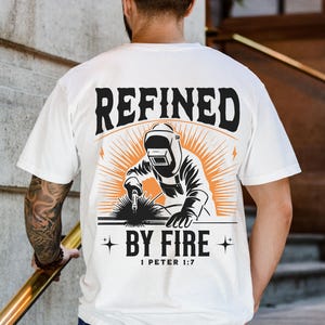 Comfort Colors Christian Welder shirt featuring the phrase “Refined by Fire,” inspired by 1 Peter 1:7. This faith-based design symbolizes strength and perseverance through trials, just as metal is refined in fire. A perfect gift for welders, linemen, or Christian men of faith. Made from soft, durable Comfort Colors fabric, available in short sleeve, long sleeve, sweatshirt, and youth sizes so dad and son can match in style while sharing their faith and hard-working spirit.