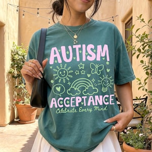 Colorful Autism Acceptance shirt featuring a bright hand drawn style design with coordinating doodles printed on a premium Comfort Colors t-shirt. Available as an adult tee, long sleeve shirt, sweatshirt, and youth short sleeve shirt. Perfect for autism acceptance, neurodiversity advocates, teachers, therapists, school staff, parents, appreciation gifts, Autism Acceptance Month, school events, and everyday comfortable wear.