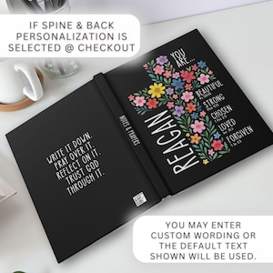 May include: Black journal with the name "Reagan" in white, a floral cross design, and inspirational text. The journal's cover features the words "You are... Beautiful, Strong, Chosen, Loved, Forgiven." The inside cover has the text "Write it down. Pray over it. Reflect on it. Trust God through it."