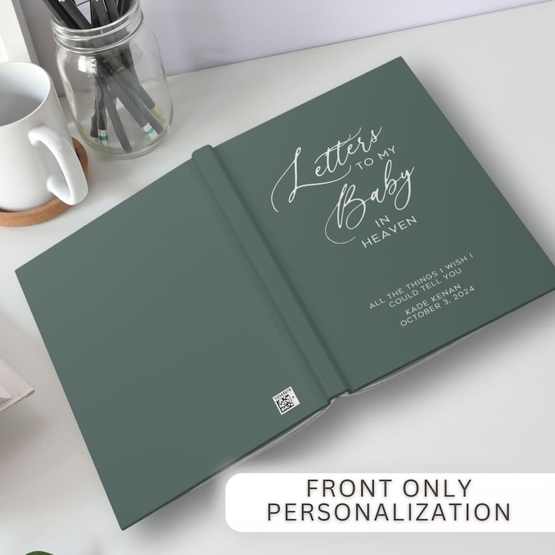 May include: A teal green hardcover journal with the title "Letters to my Baby in Heaven" in white script. The text "All the things I wish I could tell you Kade Kenan October 3, 2024" is printed in white below the title.