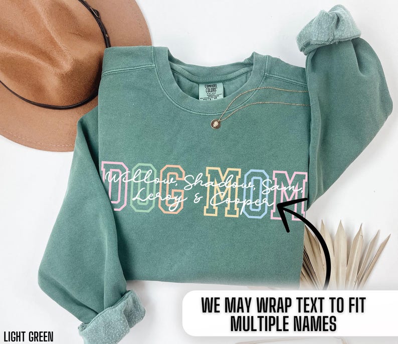 May include: Light green sweatshirt with the text "Dog Mom" in colorful letters. The text is surrounded by the names "Willow, Shadow, Sammy, Leroy & Cooper".