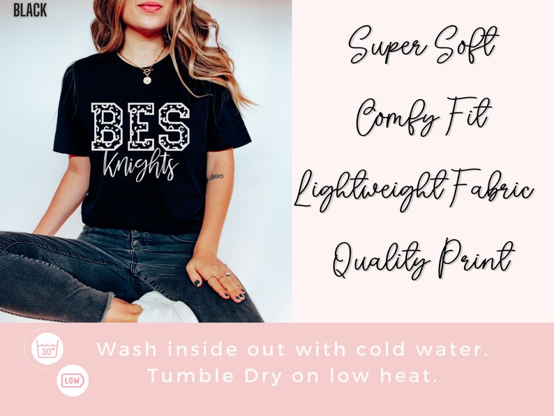 May include: Black t-shirt with the text "BES Knights" in a white, patterned font. The shirt also features the phrases "Super Soft", "Comfy Fit", "Lightweight Fabric", and "Quality Print". The care instructions are to wash inside out with cold water and tumble dry on low heat.
