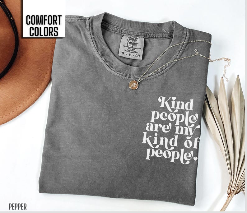 May include: Gray t-shirt with the text "Kind people are my kind of people." printed in white. The shirt is made by Comfort Colors.