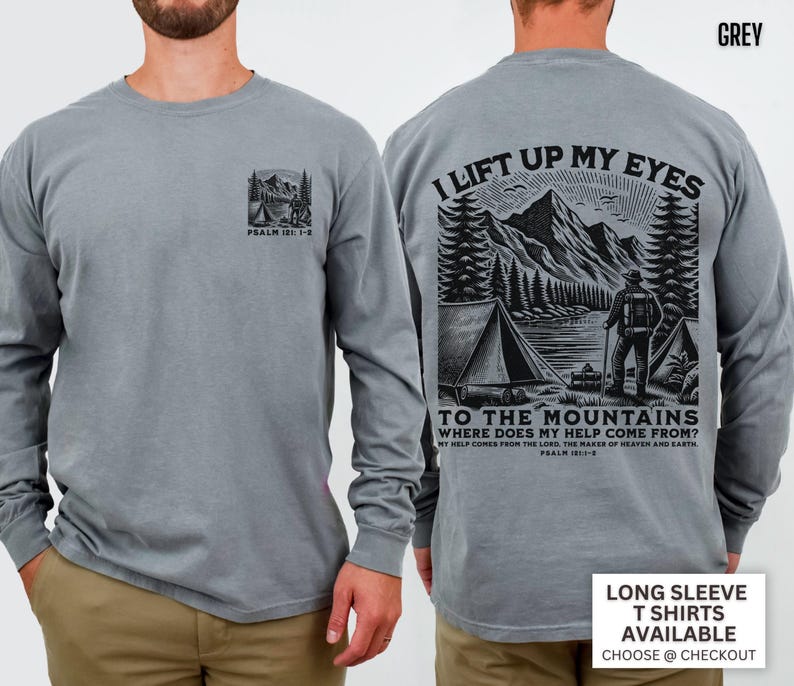 May include: Grey long-sleeve t-shirt with a mountain and camping graphic on the front and back. The back graphic includes the text "I lift up my eyes to the mountains" and "Where does my help come from?" Psalm 121:1-2.