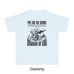 May include: A light blue t-shirt with a black and white graphic print of a knight on a horse. The graphic includes the text "Put on the whole armour of God" and a bible verse. The shirt is made of a soft, comfortable material.