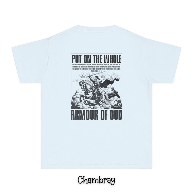 May include: A light blue t-shirt with a black and white graphic print of a knight on a horse. The graphic includes the text "Put on the whole armour of God" and a bible verse. The shirt is made of a soft, comfortable material.
