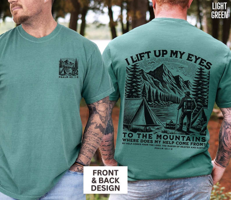 May include: Light green t-shirts with front and back designs. The front features a small mountain and tent graphic with text. The back displays a larger mountain scene with the text "I lift up my eyes to the mountains".