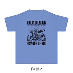 May include: A light blue t-shirt with a black graphic print of a knight on horseback. The graphic includes the text "Put on the whole armour of God" and a bible verse.