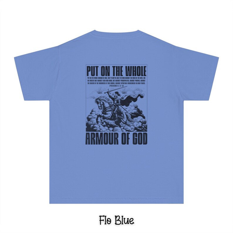 May include: A light blue t-shirt with a black graphic print of a knight on horseback. The graphic includes the text "Put on the whole armour of God" and a bible verse.
