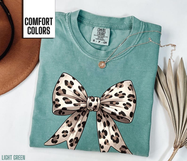 This cheetah print coquette leopard print bow shirt is the perfect gift for a woman.