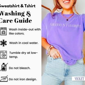 May include: A purple t-shirt with the text "Granny's Favorite" in white. The t-shirt has a care guide with instructions for washing and drying. The instructions include washing inside-out with like colors, washing in cool water, tumble drying at low temperature, not bleaching, and not ironing the design.