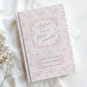 This personalized baby shower journal is a perfect keepsake for new parents, designed to collect advice and well wishes. Featuring a beautiful toile de Jouy or chinoiserie pattern, the journal comes in soft pink and blue options, making it ideal for both baby boy and baby girl showers. Customizable with the parents' names, it serves as a thoughtful and unique sign-in book, capturing cherished memories and heartfelt messages from friends and family. A timeless treasure for any baby shower.