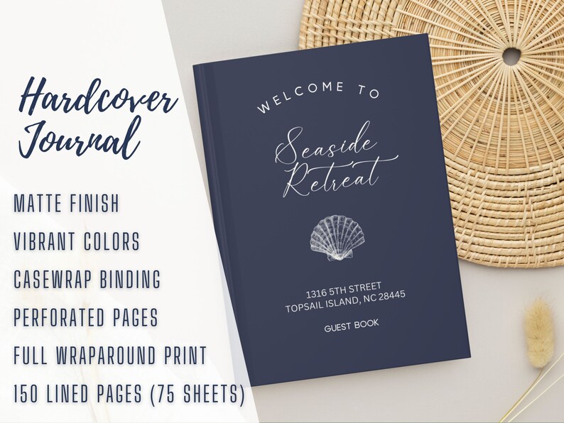 May include: A navy blue hardcover journal with the text "Welcome to Seaside Retreat" and a white seashell illustration. The journal has 150 lined pages (75 sheets) and is a guest book for a wedding or event.