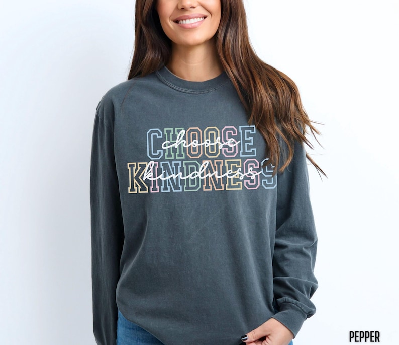 May include: A dark gray long-sleeved t-shirt with the text "Choose Kindness" in rainbow colors.