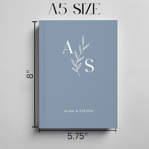 May include: An A5 size notebook in blue with a white floral design and the initials "A & S" for Alma & Steven.