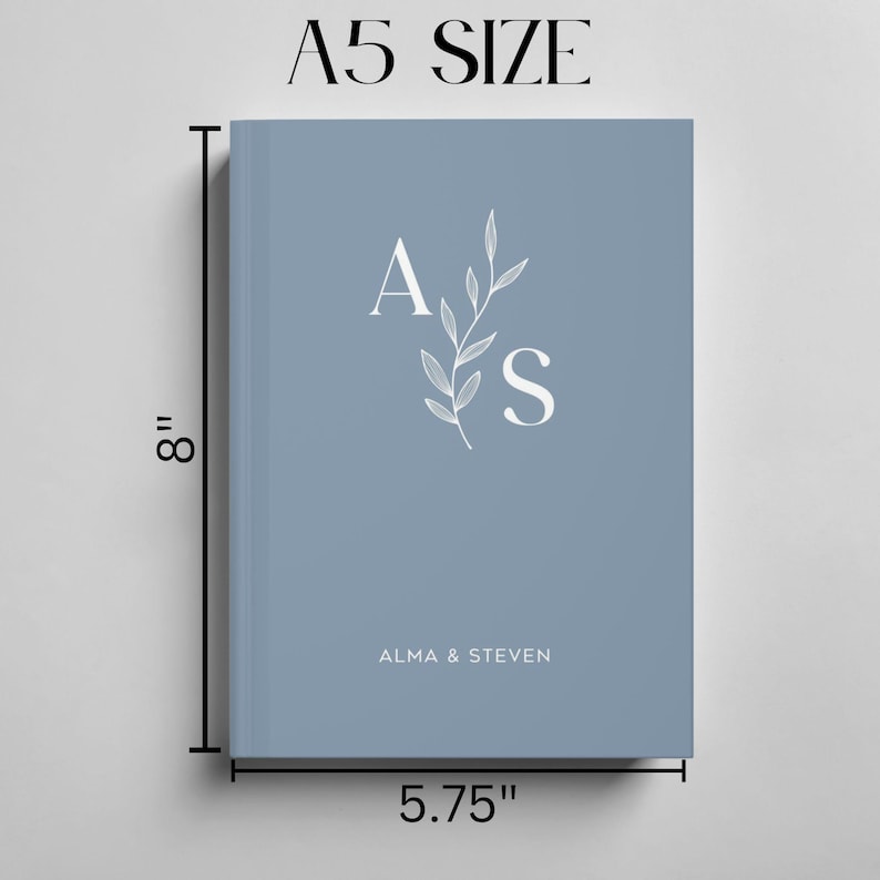 May include: An A5 size notebook in blue with a white floral design and the initials "A & S" for Alma & Steven.