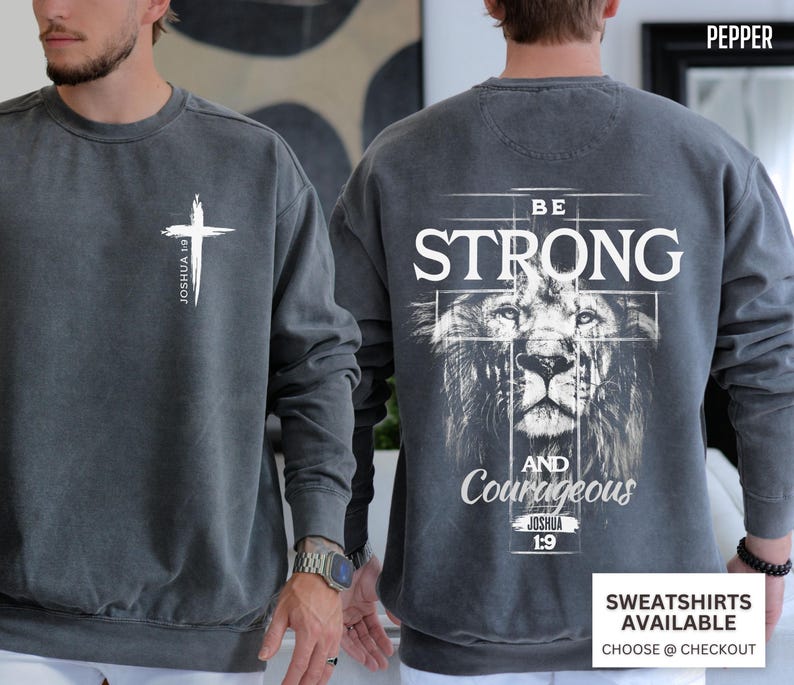 Comfort Colors Christian lion shirt with a detailed lion design on the back and a simple cross with Joshua 1:9 on the front. The Bible verse “Be strong and courageous” inspires faith and strength. Available in black, pepper, crimson, flo blue, and moss. Comes in short sleeve tee, long sleeve tee, sweatshirt, and youth sizes. Perfect gift for Christian men or boys who love bold, faith-inspired designs that remind them of God’s courage and strength.