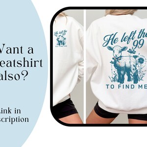 May include: White sweatshirt featuring a teal graphic of a lamb and the text "He left the 99 to find me." The back of the sweatshirt also has the same graphic. The image also includes the text "Want a sweatshirt also? Link in description."