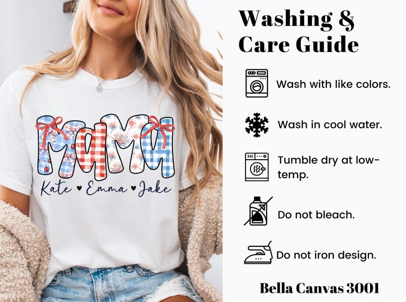 May include: White t-shirt with the word "MAMA" in a patriotic design, featuring red, white, and blue patterns and bows. Below the word "MAMA" are the names "Kate", "Emma", and "Jake". The shirt also includes a washing and care guide.
