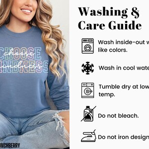May include: A blue sweatshirt with the text "CHOOSE KINDNESS" in rainbow colors. The image also includes a washing and care guide with instructions for washing inside-out, washing in cool water, tumble drying at low temperature, not bleaching, and not ironing the design.