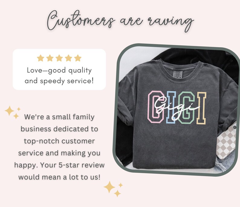May include: A black t-shirt with the word "GIGI" printed in rainbow colors. The word "Gigi" is written in cursive underneath the larger letters. The t-shirt is on a white and black checkered background.