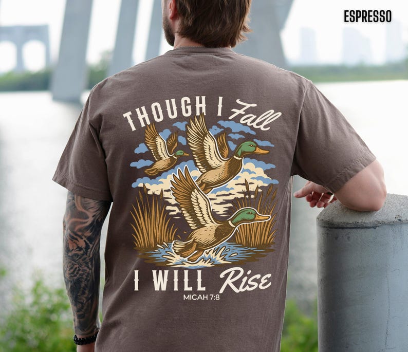 back-EspressoChristian Comfort Colors shirt featuring flying mallard ducks and Bible verse Micah 7:8 “Though I fall, I will rise.” Faith-based outdoors tee for men and women, perfect for duck hunters or nature lovers. Christian hunting apparel with rustic style and soft garment-dyed cotton for a vintage look.