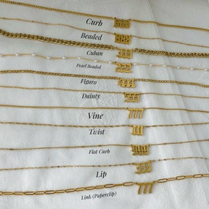 May include: A collection of gold-toned necklaces featuring various chain styles including curb, beaded, cuban, pearl beaded, figaro, dainty, vine, twist, flat curb, lip, and link paperclip, each with a unique three-digit number pendant in gothic font.